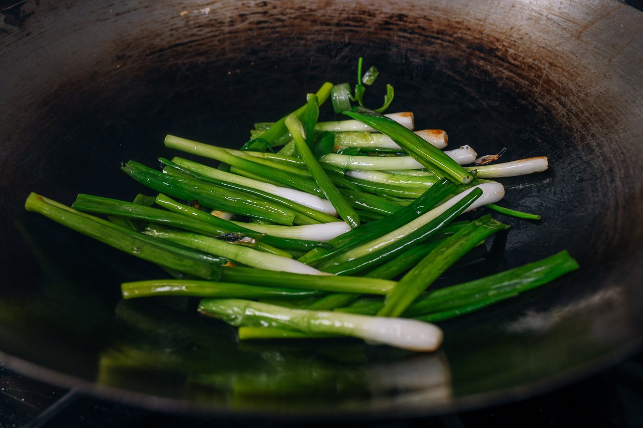 scallions in wok